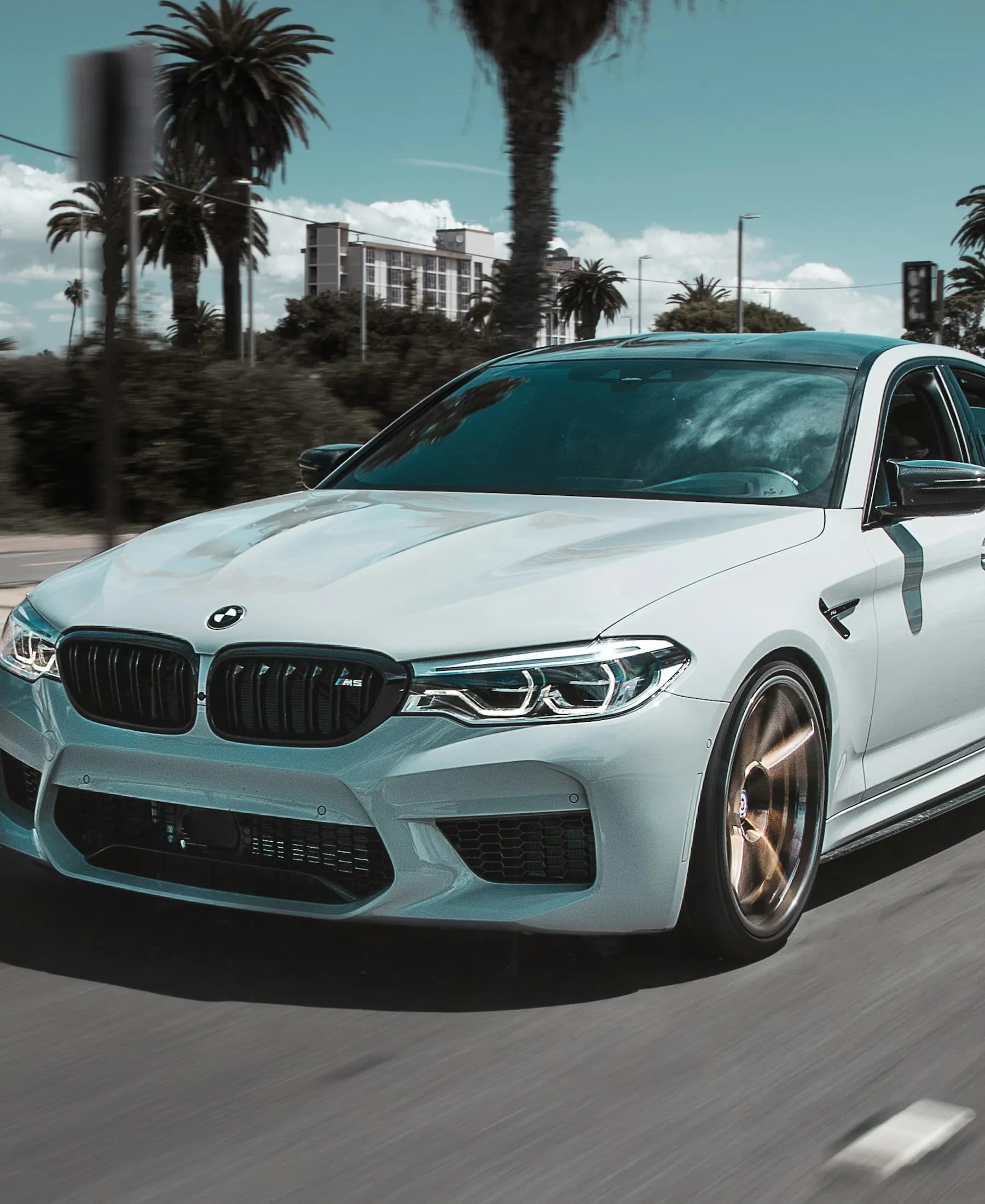 White BMW M5 sedan illustrating pre-owned sedans and coupes for sale in Oregon
