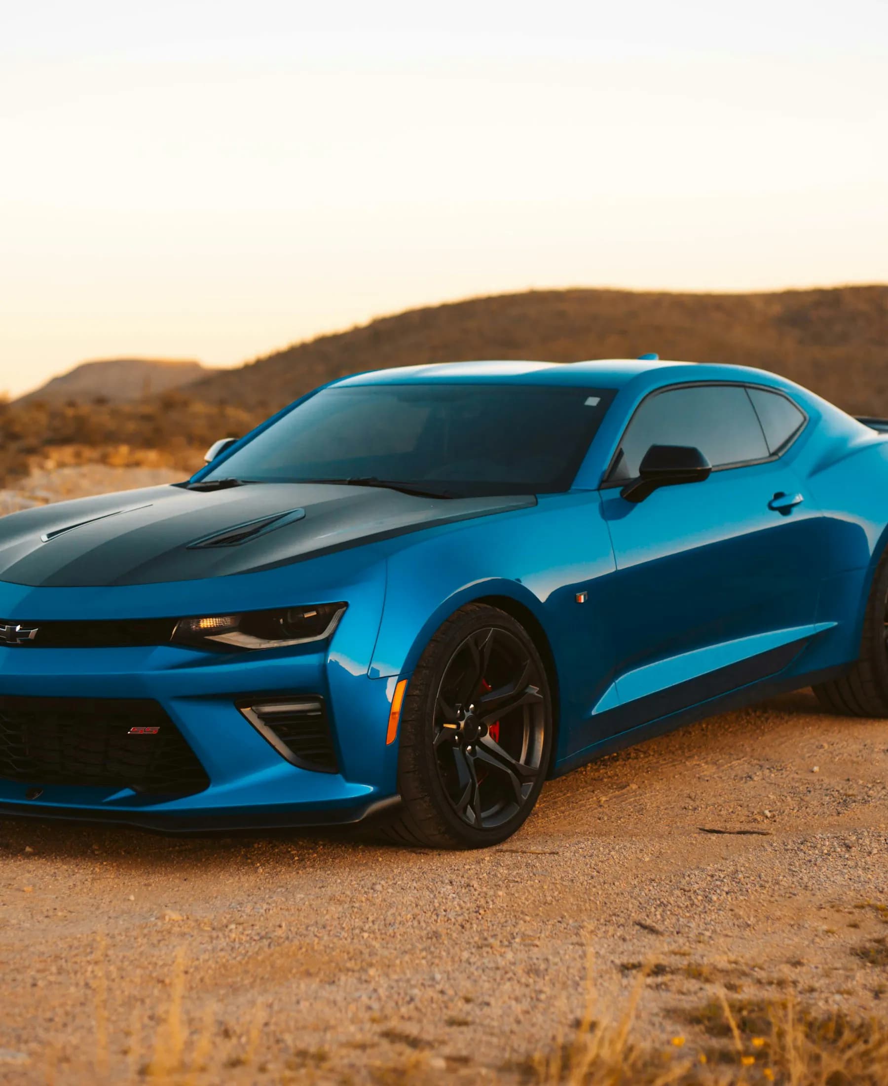 Blue Chevrolet Camaro SS coupe illustrating pre-owned sports and performance cars for sale in Oregon