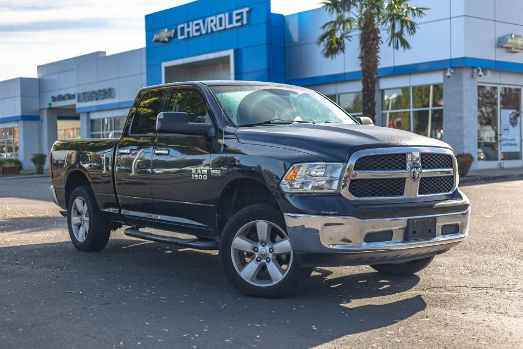 2016 Ram 1500 SLT in Brilliant Black Crystal Pearlcoat for sale at Newberg Chevrolet in Newberg, Oregon, photo 1 of 10