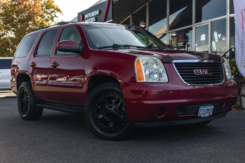 2007 GMC Yukon SLE in Sport Red Metallic for sale at Roger Kehdi Mitsubishi near Portland, Oregon, photo 1 of 25